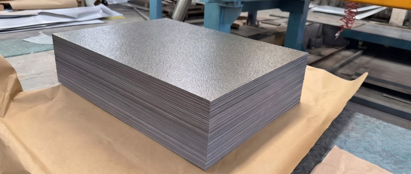 Stack of cut-to-length galvalume orange-peel embossed back panels