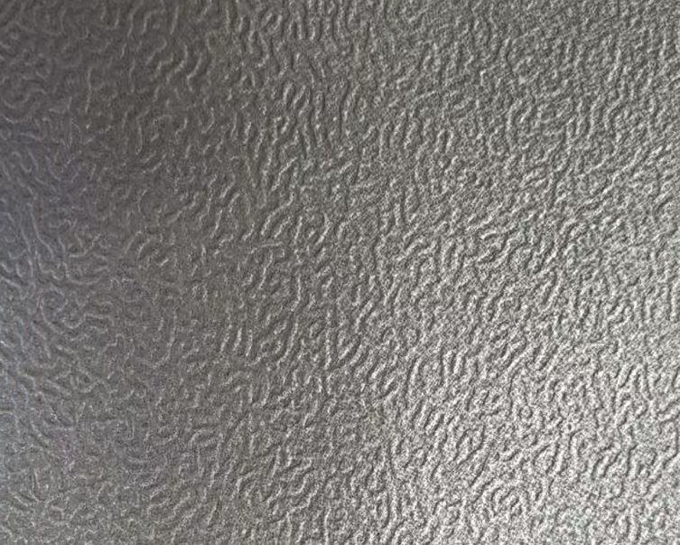 Macro photo of the deep orange-peel embossed galvalume surface